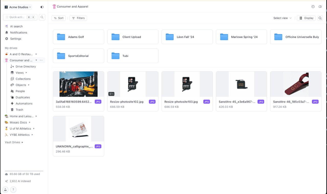Shade web app file browser for an apparel project drive, left sidebar expanded to show Drive Directory, Views, Collections, Objects, People, Duplicates, Automations and Trash, with client folders and product photo files in the main grid
